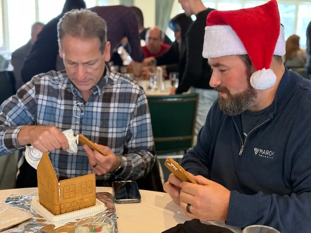 Photo of members of the Ottawa March Networks team building a gingerbread house